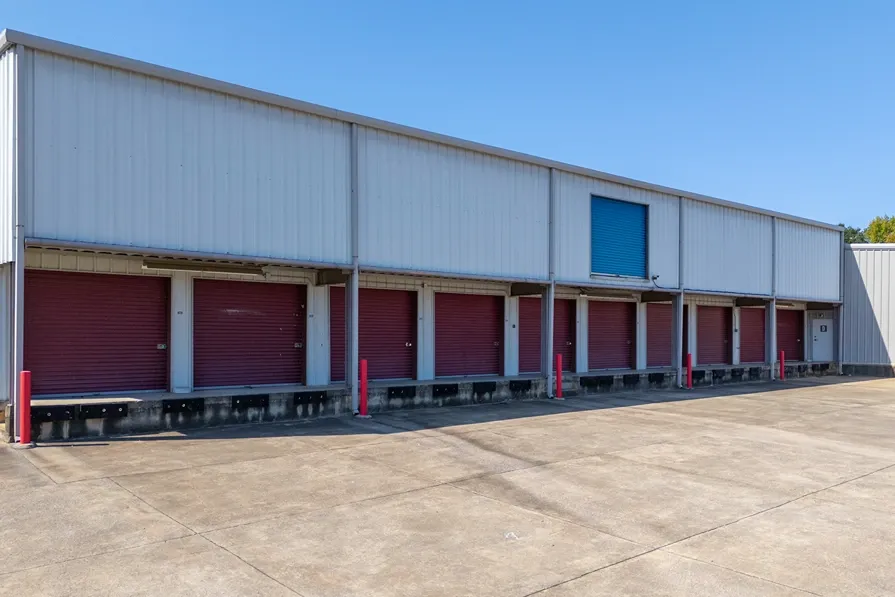 Drive-up storage units with loading dock access and roll-up doors for commercial storage